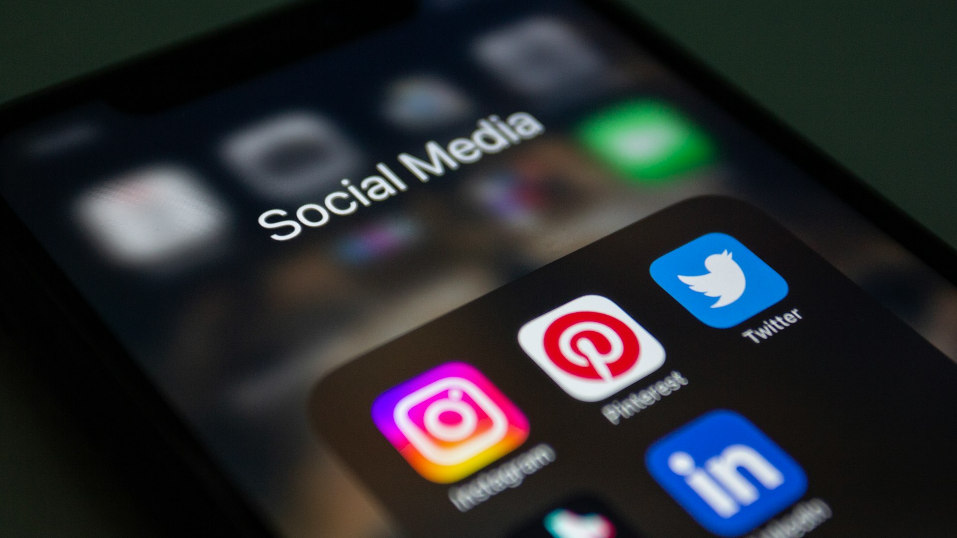 Social media Marketing Karachi Pakistan a close up of a cell phone with social media icons on it